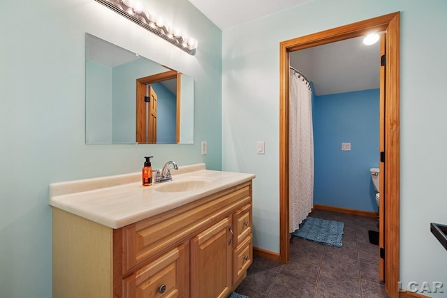 bathroom featuring tile patterned flooring and vanity