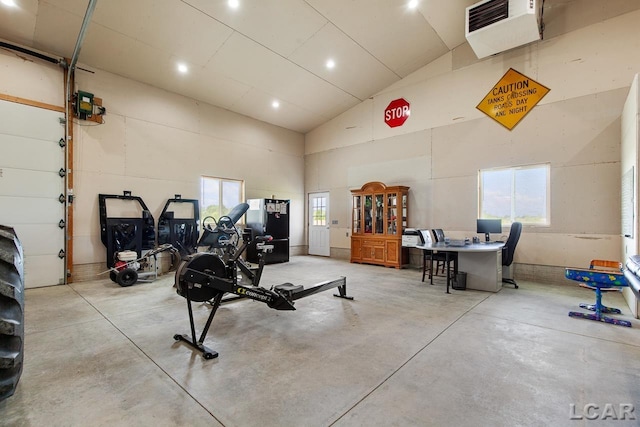 exercise area featuring a healthy amount of sunlight and vaulted ceiling