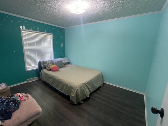 1875 Fire Rd, Twining, MI 48766 - bedroom with a textured ceiling, crown molding, and dark wood-type flooring