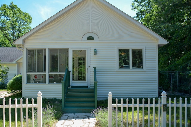 view of front of house with a sunroom