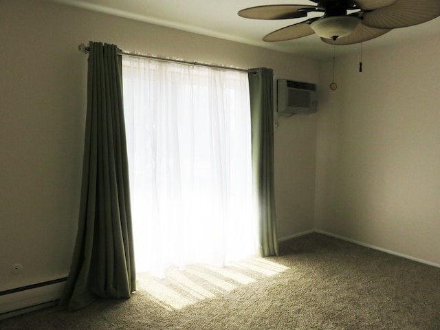 empty room with baseboard heating, ceiling fan, a wall mounted AC, and carpet floors