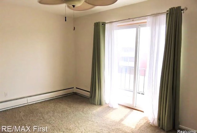 spare room with baseboard heating, ceiling fan, and carpet flooring