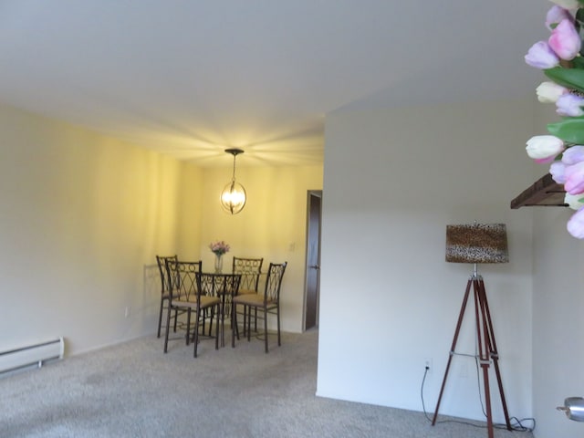 dining space with a baseboard radiator and carpet flooring