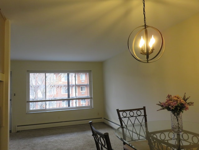 interior space featuring a chandelier, carpet floors, and a baseboard heating unit