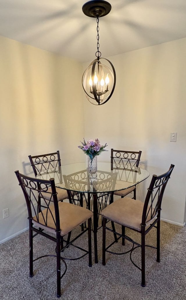 carpeted dining space with a chandelier