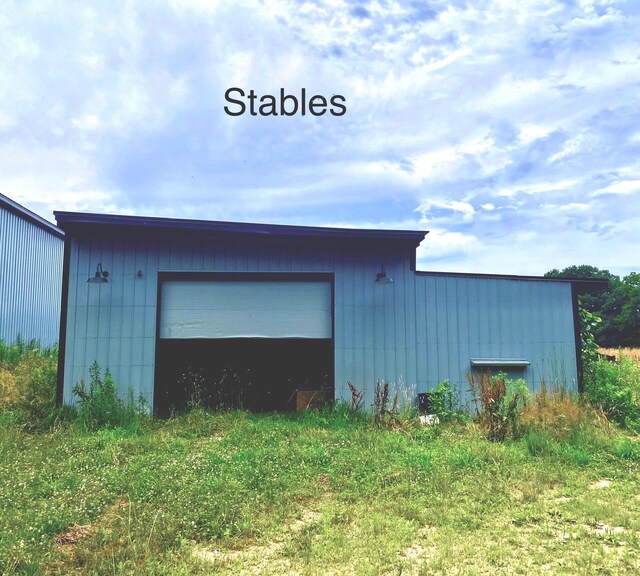 9400 Kruger Rd, Union Pier, MI 49129 - view of property exterior featuring an outbuilding and a garage