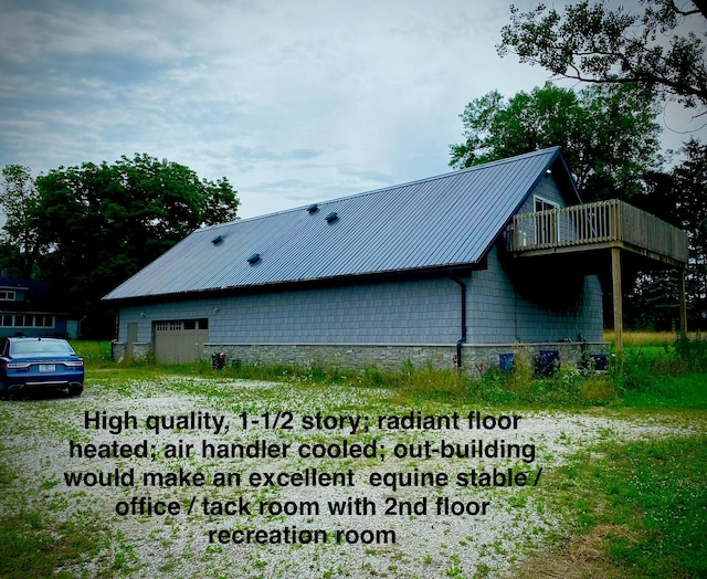 9400 Kruger Rd, Union Pier, MI 49129 - view of property exterior featuring metal roof and a garage