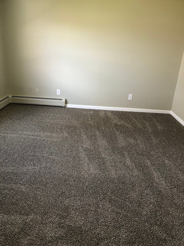 5510 Berkley Dr, Waterford, MI 48327 - carpeted spare room with baseboards and a baseboard radiator
