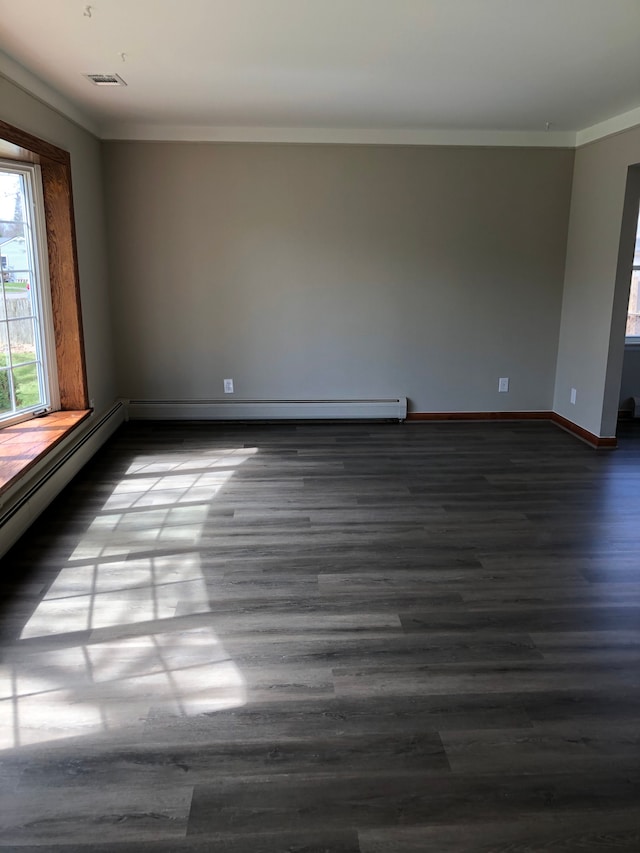 5510 Berkley Dr, Waterford, MI 48327 - spare room with ornamental molding, dark wood-type flooring, and baseboards