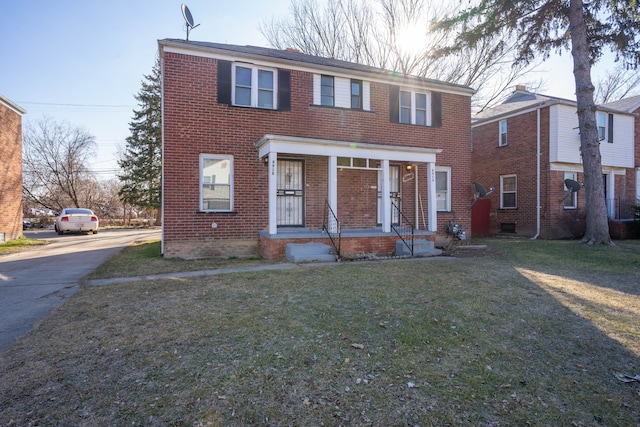 view of front of home with a porch and a front lawn