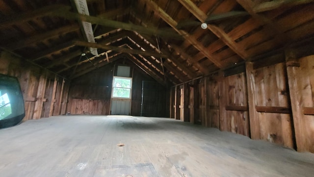 miscellaneous room with lofted ceiling