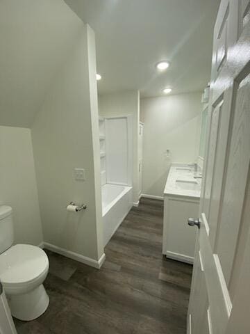 203 E Mill St, Athens, MI 49011 - full bathroom featuring toilet, vanity, baseboards, wood finished floors, and recessed lighting