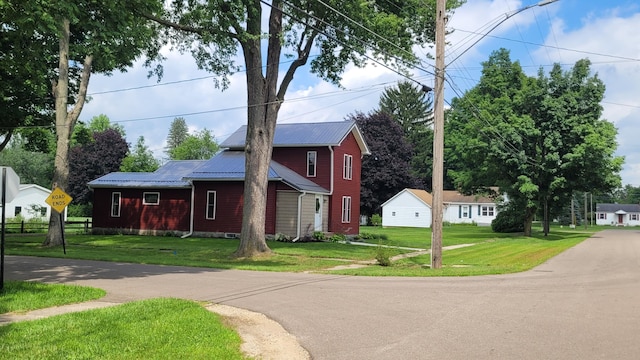 view of property exterior with a lawn