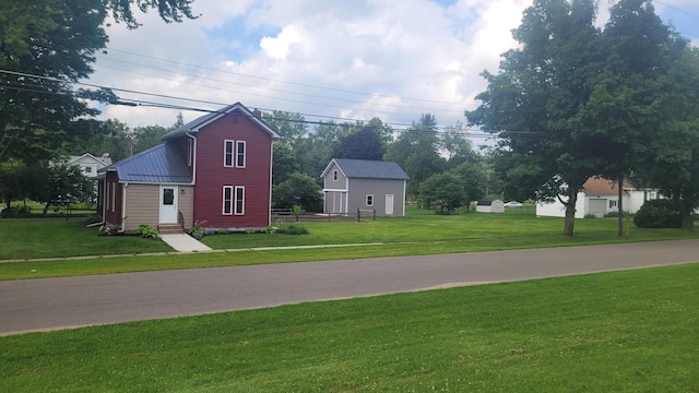 view of property exterior featuring a lawn