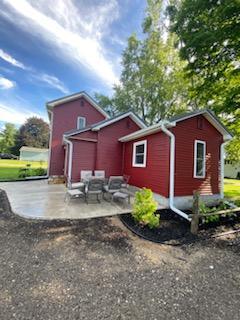 203 E Mill St, Athens, MI 49011 - back of house with a patio area