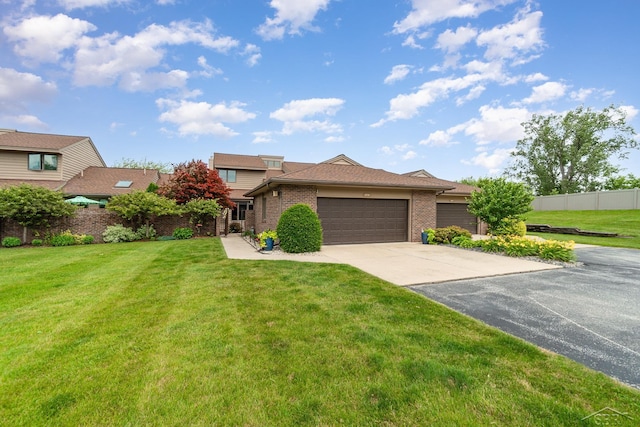 view of front of property with a garage and a front lawn