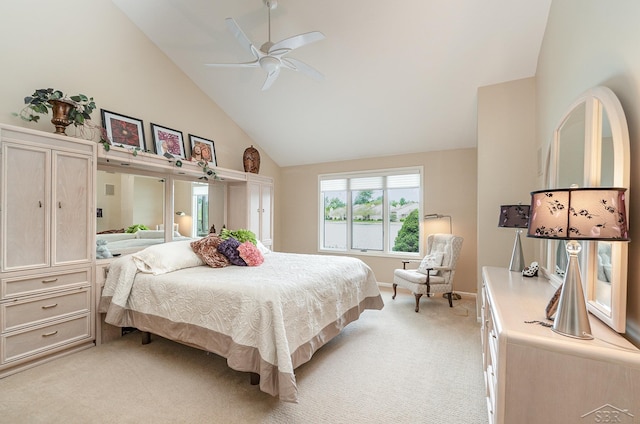 carpeted bedroom with high vaulted ceiling and ceiling fan