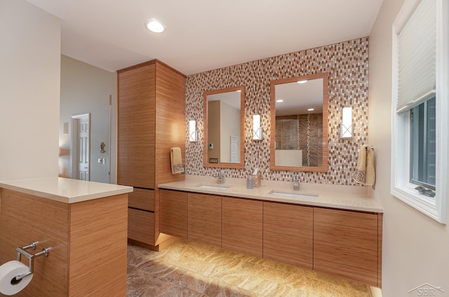 bathroom featuring tasteful backsplash and vanity