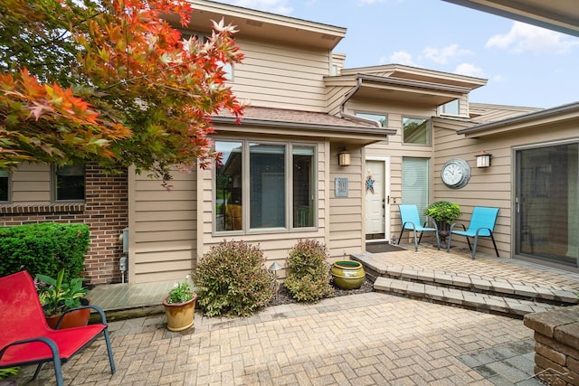 doorway to property with a patio