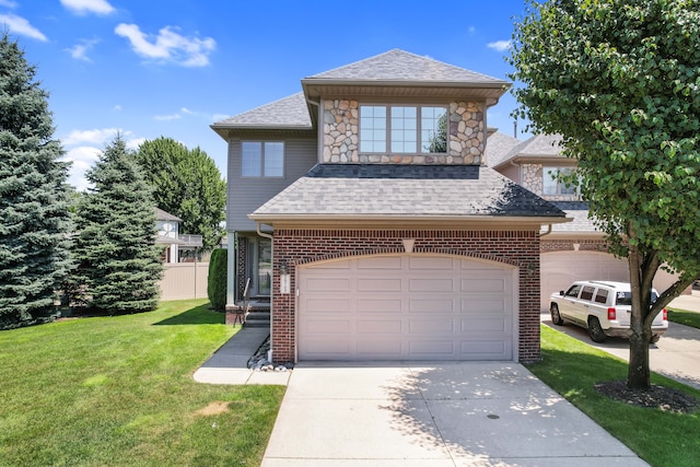 view of front of property with a front yard and a garage