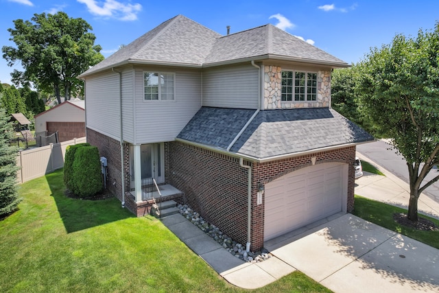 view of front of property featuring a garage and a front lawn