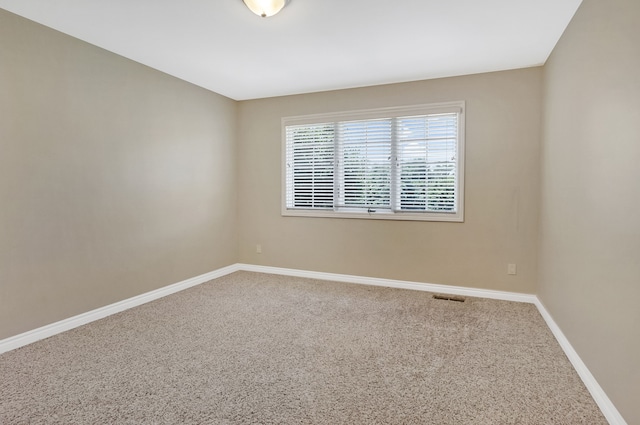 empty room with carpet flooring