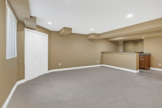 basement featuring carpet flooring