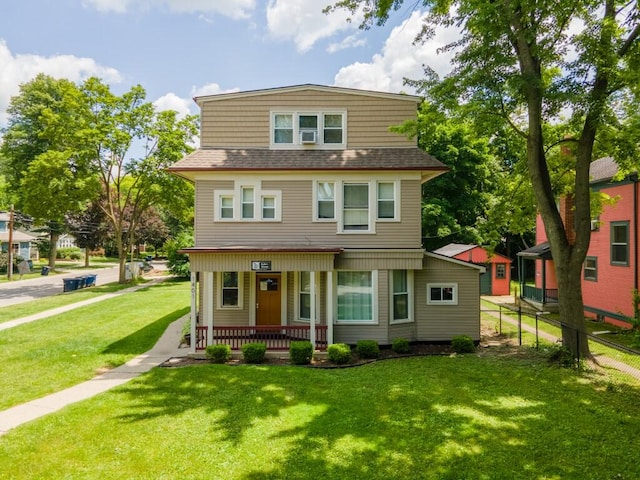 view of front of home with a porch and a front lawn