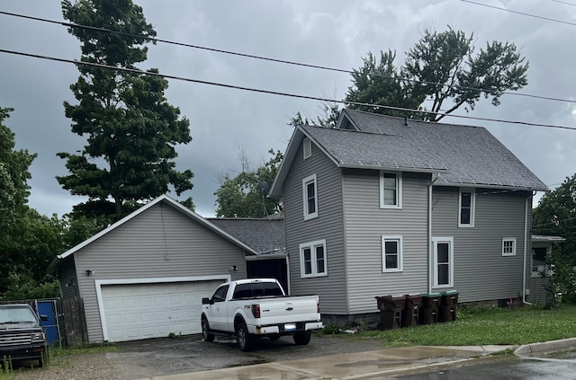 view of side of property with a garage