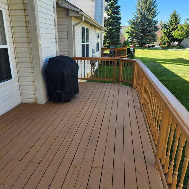 2233 Maplehurst Dr, Walled Lake, MI 48390 - wooden terrace with area for grilling and a yard