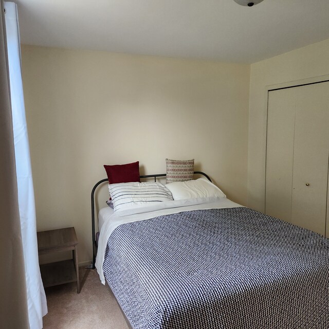 2233 Maplehurst Dr, Walled Lake, MI 48390 - carpeted bedroom featuring a closet