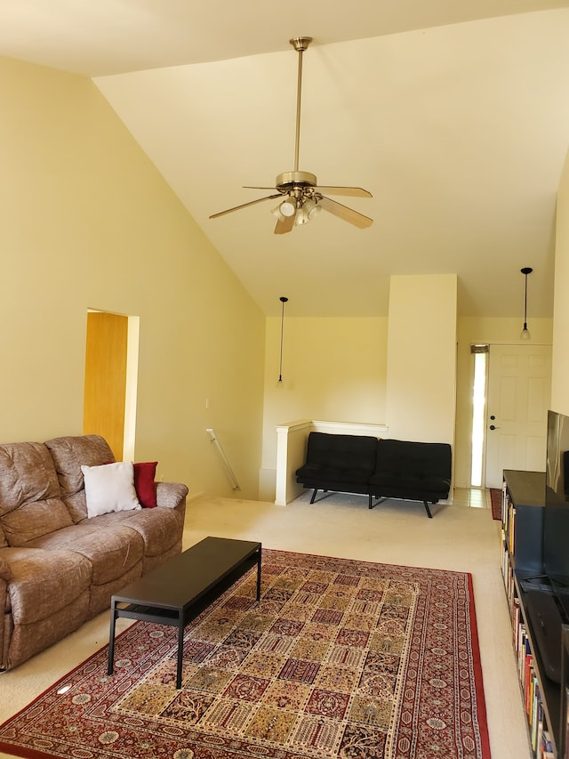 living room with ceiling fan, carpet floors, and high vaulted ceiling