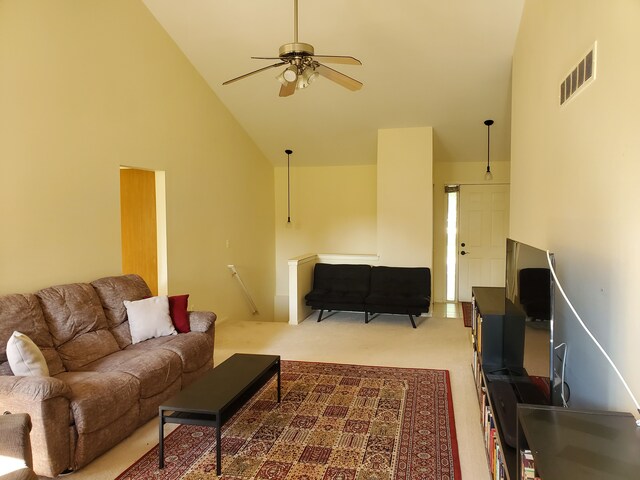 2233 Maplehurst Dr, Walled Lake, MI 48390 - carpeted living room featuring high vaulted ceiling and ceiling fan