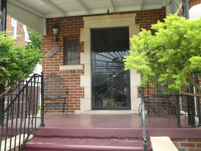 entrance to property with covered porch