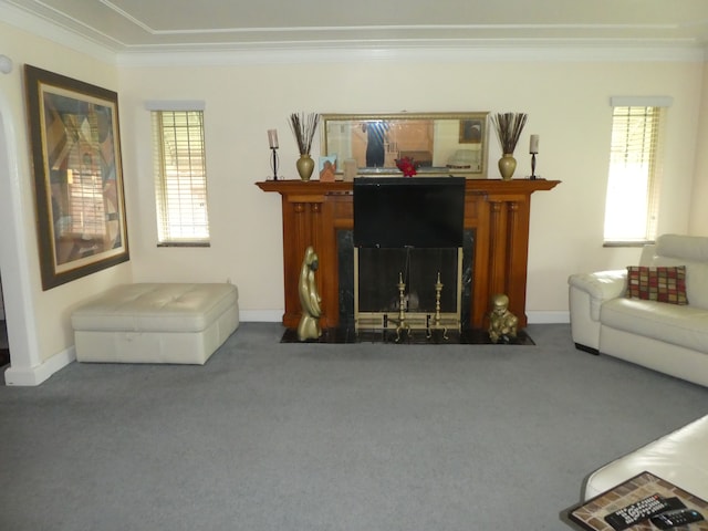 carpeted living room with ornamental molding