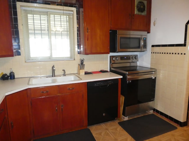 kitchen with sink, stainless steel appliances, and tasteful backsplash