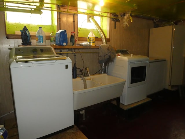 laundry area featuring separate washer and dryer and sink