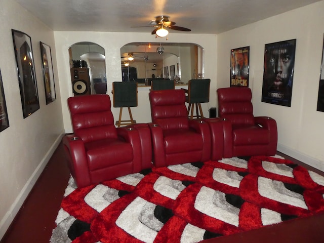 home theater room featuring ceiling fan