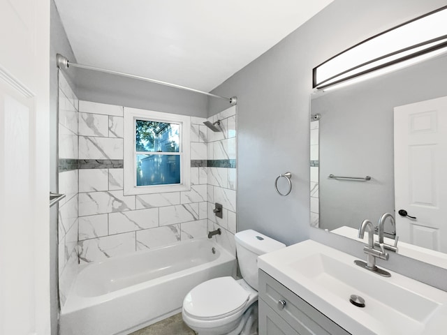 full bathroom featuring toilet, vanity, and tiled shower / bath