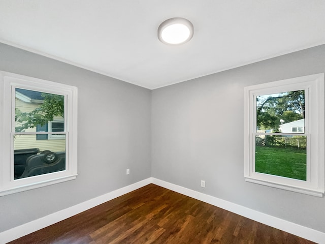 100 E Kalama Ave, Madison Heights, MI 48071 - unfurnished room featuring dark wood finished floors and baseboards