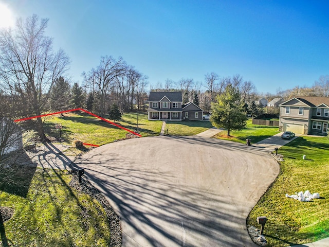 view of property's community with a lawn