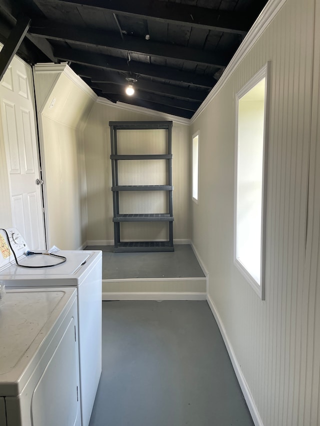 clothes washing area with washer and clothes dryer