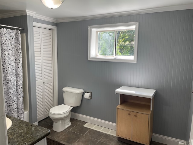 full bathroom with vanity, tile patterned floors, crown molding, toilet, and shower / tub combo