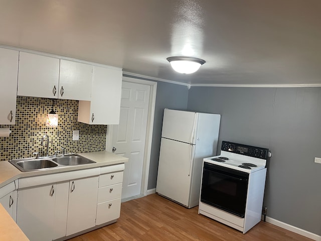 kitchen featuring white appliances, white cabinets, crown molding, sink, and light wood-type flooring