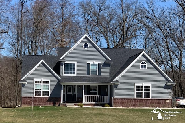 view of front of house featuring a porch and a front yard