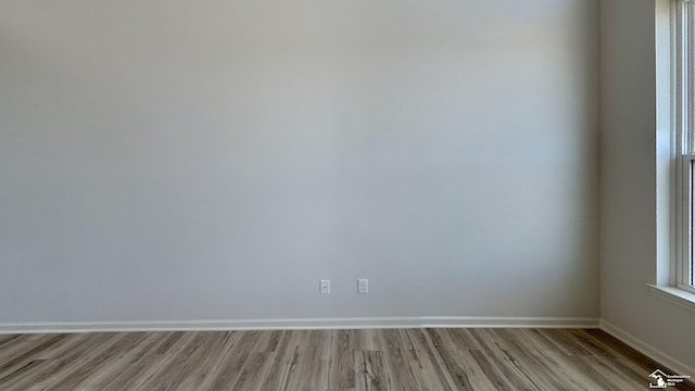 unfurnished room featuring light hardwood / wood-style floors