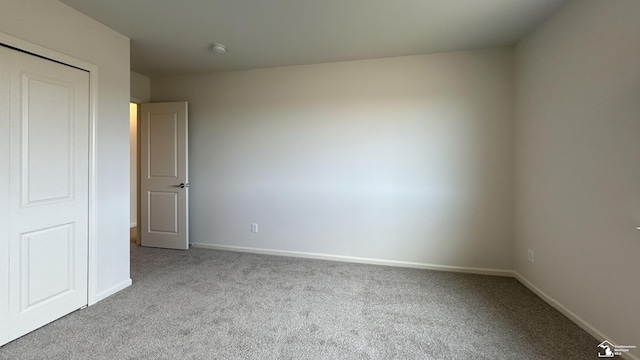 unfurnished bedroom with light colored carpet