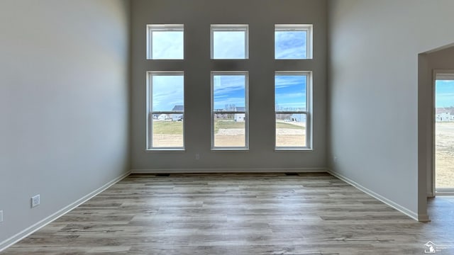 spare room with light wood-type flooring