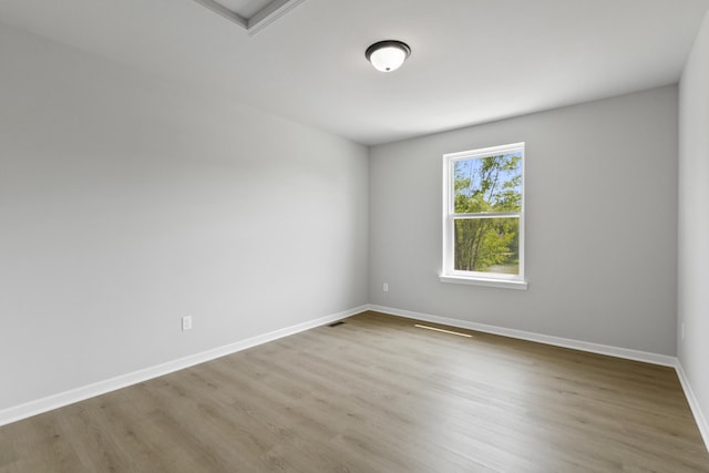 31421 Augusta Dr Unit 76, Romulus, MI 48174 - spare room featuring wood finished floors