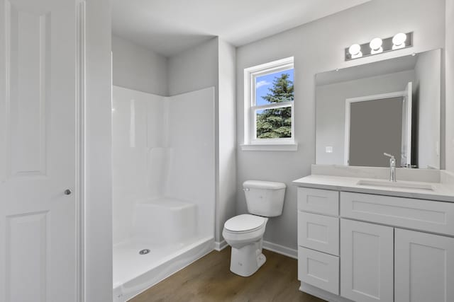 31421 Augusta Dr Unit 76, Romulus, MI 48174 - full bathroom featuring vanity, wood finished floors, and a shower